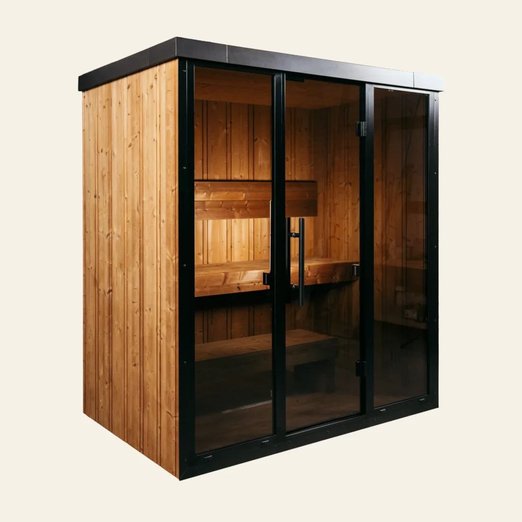 OneEighty Medium Outdoor sauna in natural thermo spruce, angled view with black aluminium glass front