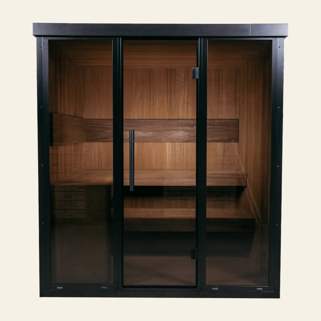 OneEighty Large Outdoor sauna, front view with black aluminium glass facade and the L-shaped bench inside