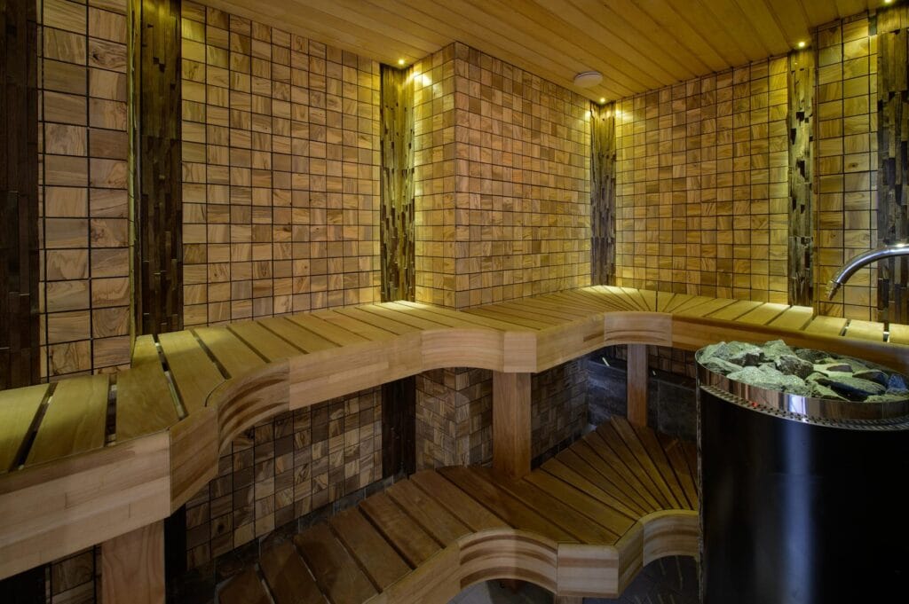 Olive Square wood tiles lining a warm spa sauna, EmotionWood