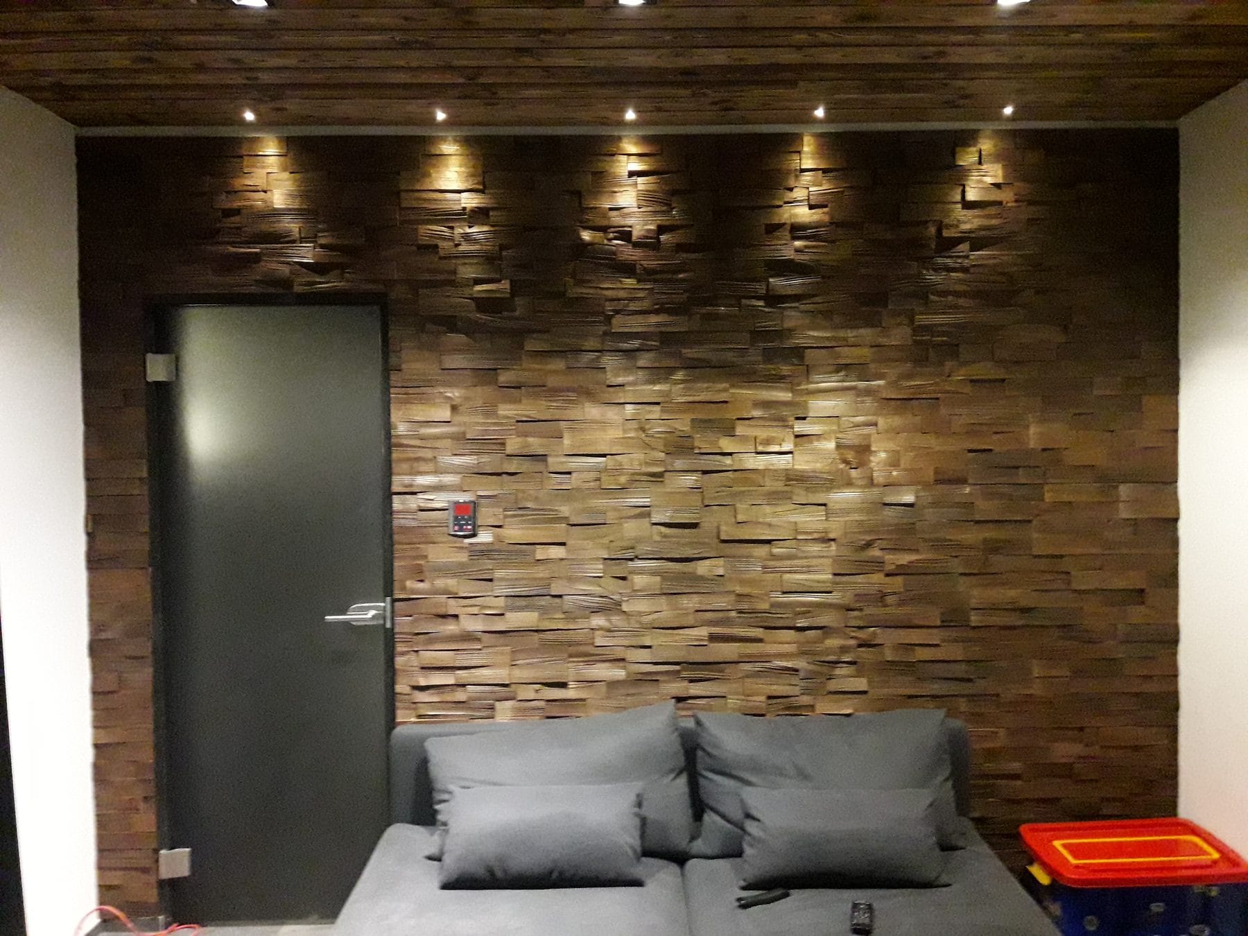 Trail 58 thermo-ash feature wall in a media room, EmotionWood