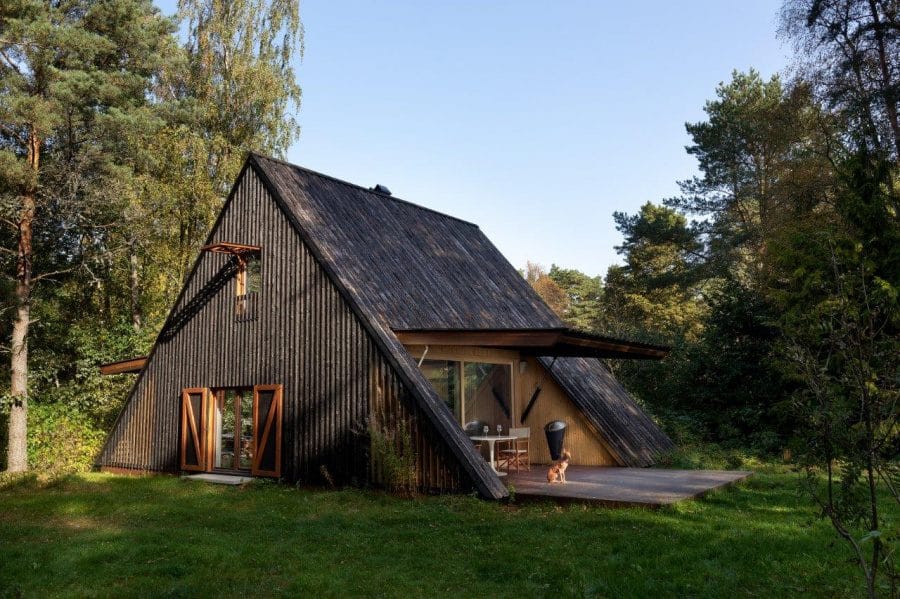 A-frame forest house clad in charred yakisugi timber